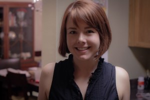 Photo of woman inside at night